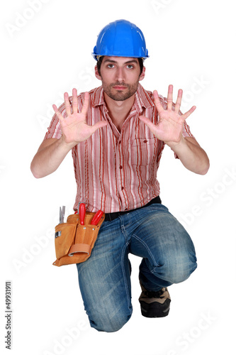Photo: Tradesman holding up his hands Tradesman holding up his hands