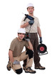 two craftsmen working with drills