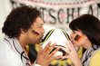 German soccer fans kissing ball