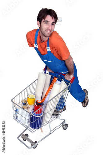 Photo: Painter with utensils in shopping cart Painter with utensils in shopping cart