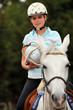 Young blond woman playing Horse ball