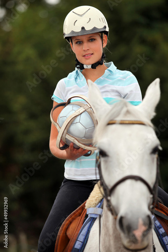 Photo: Young blond woman playing Horse ball Young blond woman playing Horse ball