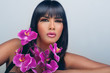 Photo: Woman with beautiful makeup and pink orchids Woman with beautiful makeup and pink orchids