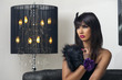 Photo: beautiful luxurious woman sitting & sensually posing beautiful luxurious woman sitting & sensually posing