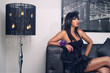 Photo: beautiful luxurious woman sitting & sensually posing beautiful luxurious woman sitting & sensually posing