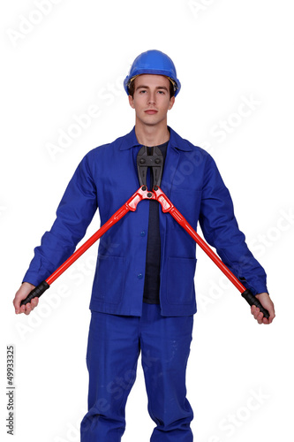 Photo: Man with a pair of long handled cutters Man with a pair of long handled cutters