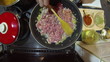 Chef Frying Minced Meat In A Pan