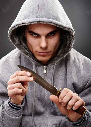 Photo: Closeup pose of a dangerous gangster Closeup pose of a dangerous gangster
