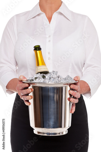 Photo: Waitress with Champagne bottle in Ice bucket Waitress with Champagne bottle in Ice bucket