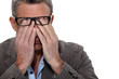 Man rubbing his eyes