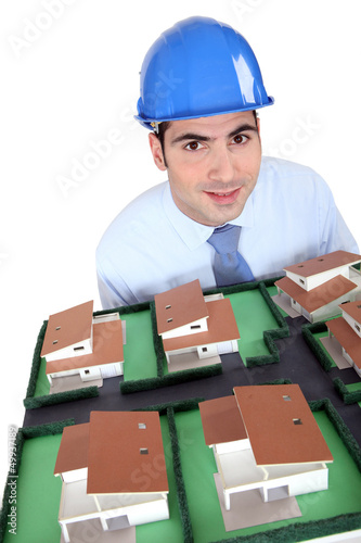 Photo: Architect holding an architectural model Architect holding an architectural model