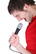 Man singing into microphone