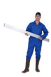 Tradesman carrying a girder