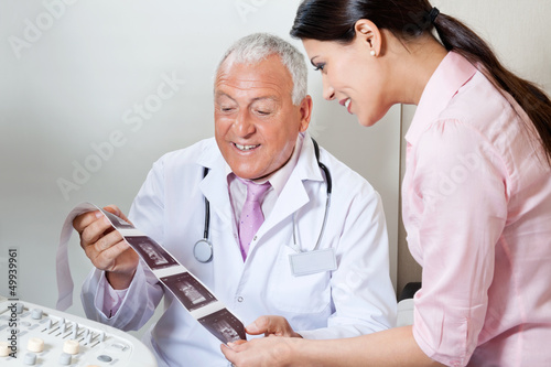 Photo: Doctor And Patient Looking At Ultrasound Print Doctor And Patient Looking At Ultrasound Print