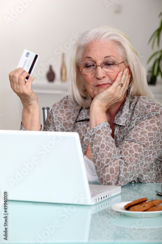 Photo: Elderly woman shopping on-line Elderly woman shopping on-line