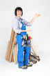 Female carpenter indicating the space to her side