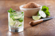 Mojito served in a glass with crushed ice and lime