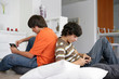 Foto: Teenage boys with handheld devices Teenage boys with handheld devices