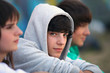 Foto: Three teenagers sat together Three teenagers sat together