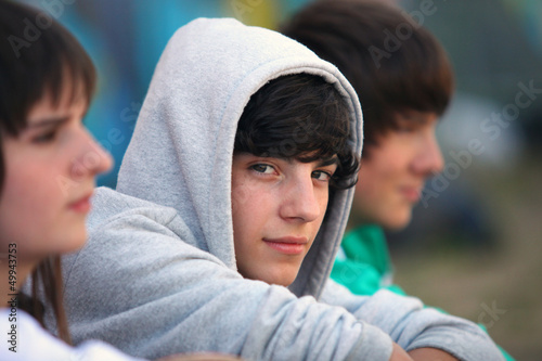 Photo: Three teenagers sat together Three teenagers sat together