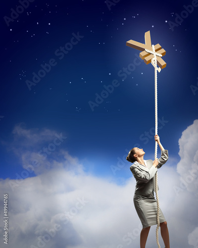 Photo: Image of businesswoman climbing the rope Image of businesswoman climbing the rope