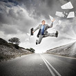 Businessman running on the road