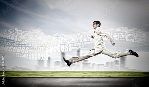 Photo: Businessman running on the road Businessman running on the road
