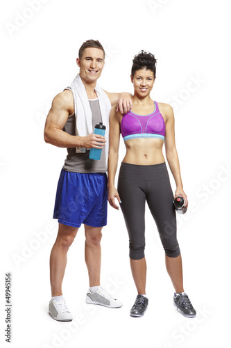 Photo: Young man and woman relaxing in sports outfits Young man and woman relaxing in sports outfits