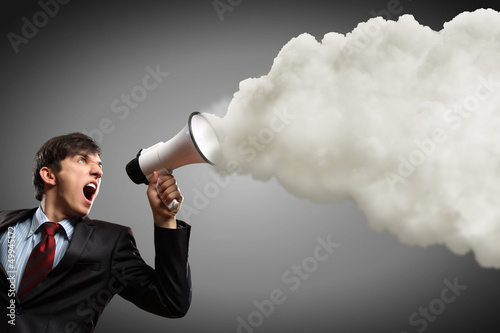 Photo: businessman with megaphone businessman with megaphone