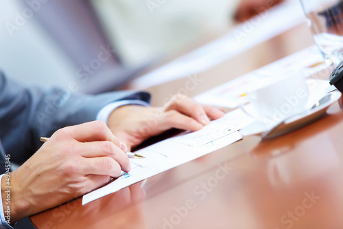 Photo: Hands of businessman writing Hands of businessman writing