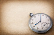 Old pocket watch on vintage paper