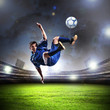 football player striking the ball