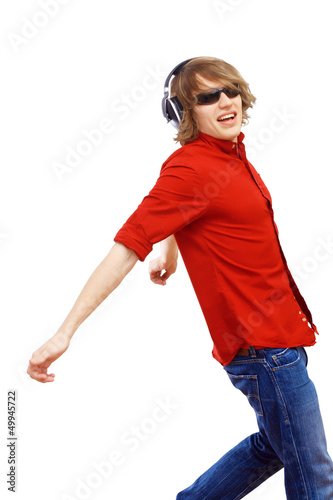Photo: Happy smiling young man dancing Happy smiling young man dancing