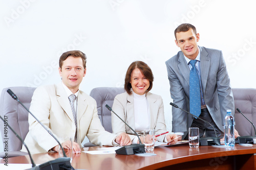Photo: Three businesspeople at meeting Three businesspeople at meeting
