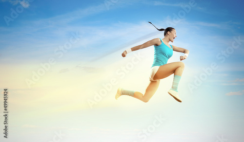 Photo: Image of sport woman jumping Image of sport woman jumping