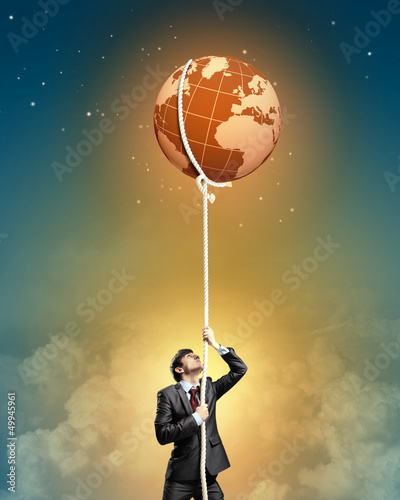 Photo: Image of businessman climbing rope Image of businessman climbing rope