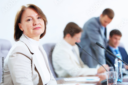 Photo: Four businesspeople at meeting Four businesspeople at meeting