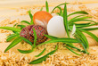 Three eggs in nest from grass