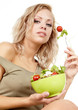 The young beautiful woman with the fresh vegetables