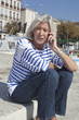 senior woman managing problems on the telephone