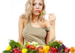 The young beautiful woman with the fresh vegetables