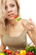 The young beautiful woman with the fresh vegetables