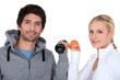 Young couple with dumbbells