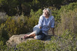 smiling senior woman enjoying natural quietness