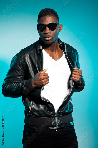 Photo: Cool urban stylish black american man. Fashion studio shot. Cool urban stylish black american man. Fashion studio shot.