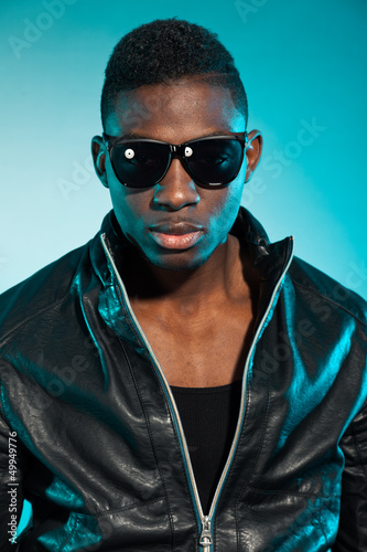 Photo: Cool urban stylish black american man. Fashion studio shot. Cool urban stylish black american man. Fashion studio shot.