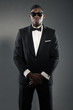 Cool stylish black american man in gala suit. Fashion shot.