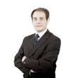 Young nostalgic businessman with arms folded