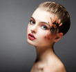 Fantasy. Spider sitting on Pretty Woman Face. Creativity