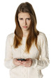 Woman is feeling sad while reading sms on mobile phone